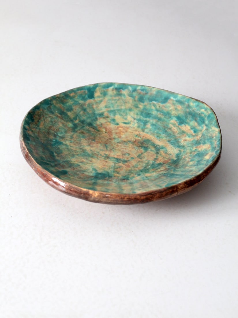 Handmade Vintage Freeform Pottery Platter in Mottled Green and Teal: Handmade Vintage Freeform Pottery Platter in Mottled Green and Teal This vintage handmade studio pottery platter showcases an elegant organic freeform shape complemented by a softly elevated base, enh