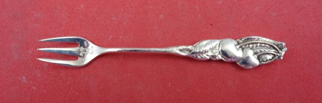 Tiffany & Co Sterling Silver Cherry Fork 3 Tine Monogrammed: Tiffany & Co Sterling Silver Cherry Fork 3 Tine Monogrammed This exquisite 3-tine cherry fork from Tiffany & Co. features a timeless design and is crafted from high-quality sterling silver. The fork i