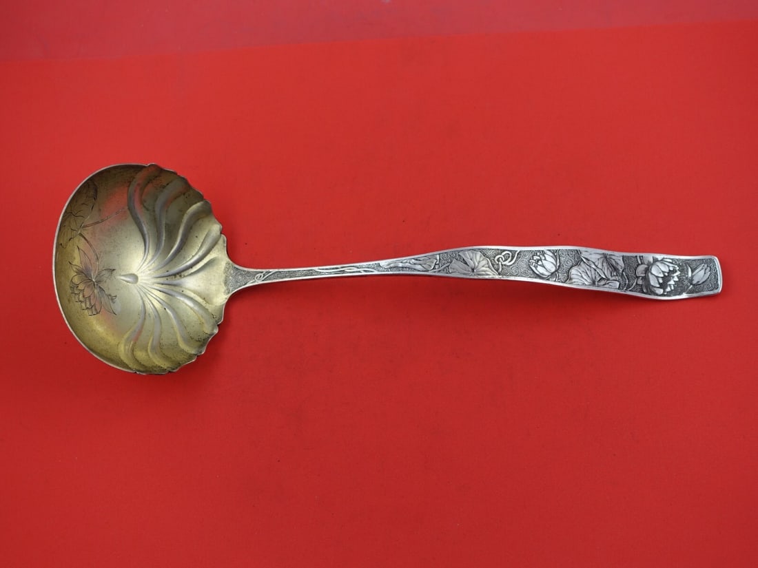 Towle Orchids Sterling Silver Soup Ladle 12 1/2 Inch Gold-Washed Bowl: Towle Orchids Sterling Silver Soup Ladle 12 1/2 Inch Gold-Washed Bowl This exquisite soup ladle from Towle's "Orchids" pattern showcases the elegance of sterling silver craftsmanship. Measuring 12 1/2