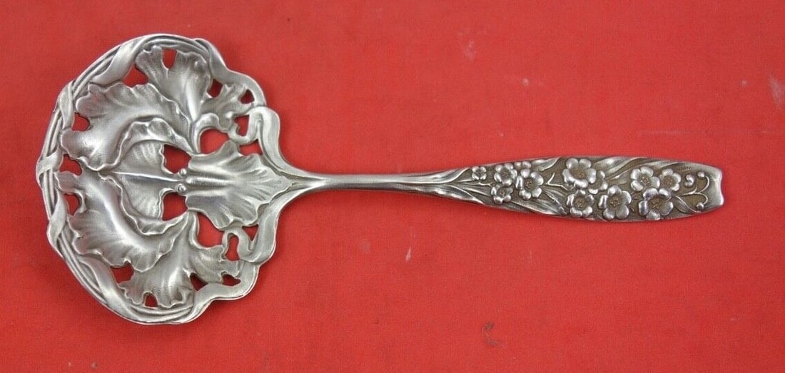 Shiebler Flora Sterling Silver Nut Spoon Chicago 1906 4.5": Shiebler Flora Sterling Silver Nut Spoon Chicago 1906 4.5" This exquisite nut spoon is a fine example of the Flora pattern by Shiebler, crafted in 1906 in Chicago. Made from sterling silver, it showca
