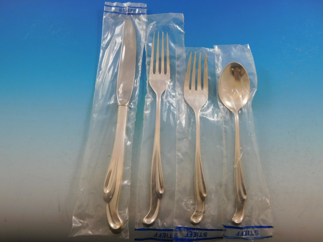 Stieff Silver Surf Sterling Silver Flatware Set for 12 48 Pieces Unused: Stieff Silver Surf Sterling Silver Flatware Set for 12 48 Pieces Unused Experience the elegance of mid-century dining with the Silver Surf flatware set by Stieff. This exquisite sterling silver set, c