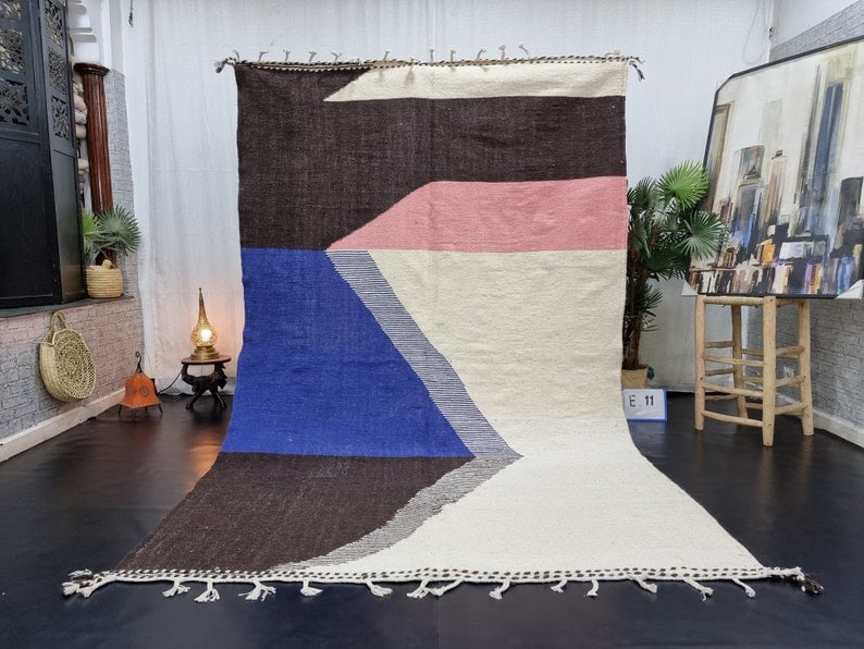 Authentic Handmade Moroccan Berber Wool Area Rug 9.84 x 6.56 ft: Authentic Handmade Moroccan Berber Wool Area Rug 9.84 x 6.56 ft Experience the vibrant artistry of Morocco with this stunning handmade Berber wool area rug. Handwoven by skilled local Berber women in