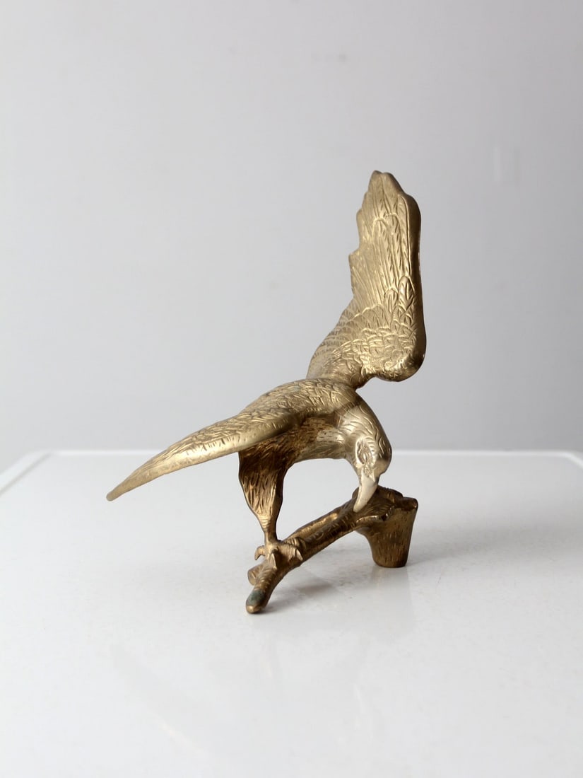 Vintage Solid Brass Eagle Sculpture 8.75 x 6.75 x 11 Inch: Vintage Solid Brass Eagle Sculpture 8.75 x 6.75 x 11 Inch This vintage solid brass eagle sculpture showcases intricate detailing and a striking design. Its robust construction and aged patina contribu