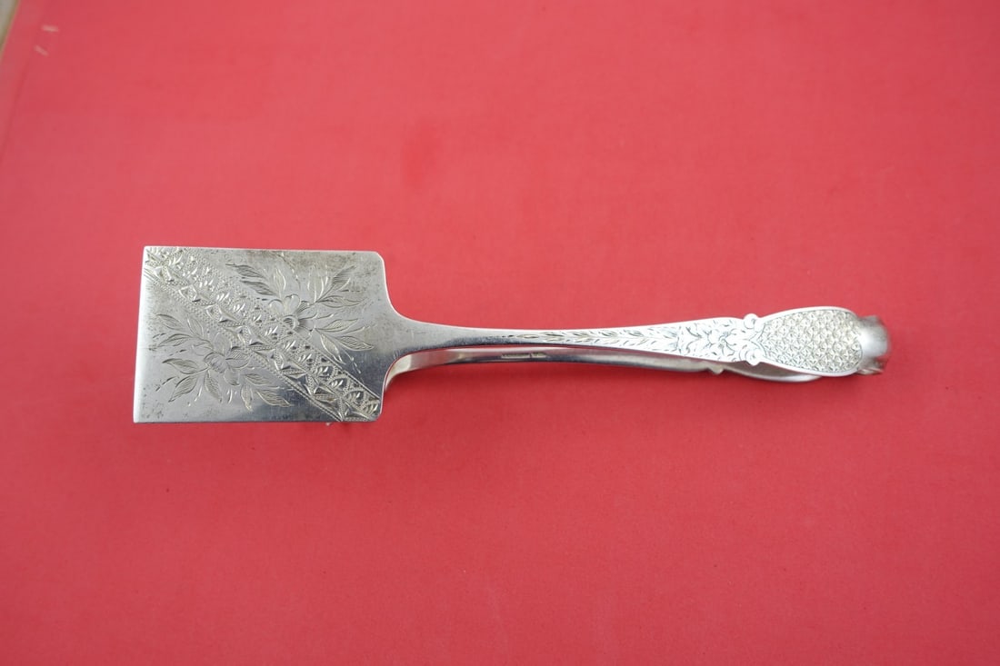 Kirk Silver Pastry Tongs 9 Bright-Cut 10 oz Hallmark Serving Piece: Kirk Silver Pastry Tongs 9 Bright-Cut 10 oz Hallmark Serving Piece Discover a stunning piece of history with these silver pastry tongs by Kirk, featuring a unique and unknown pattern. Crafted between