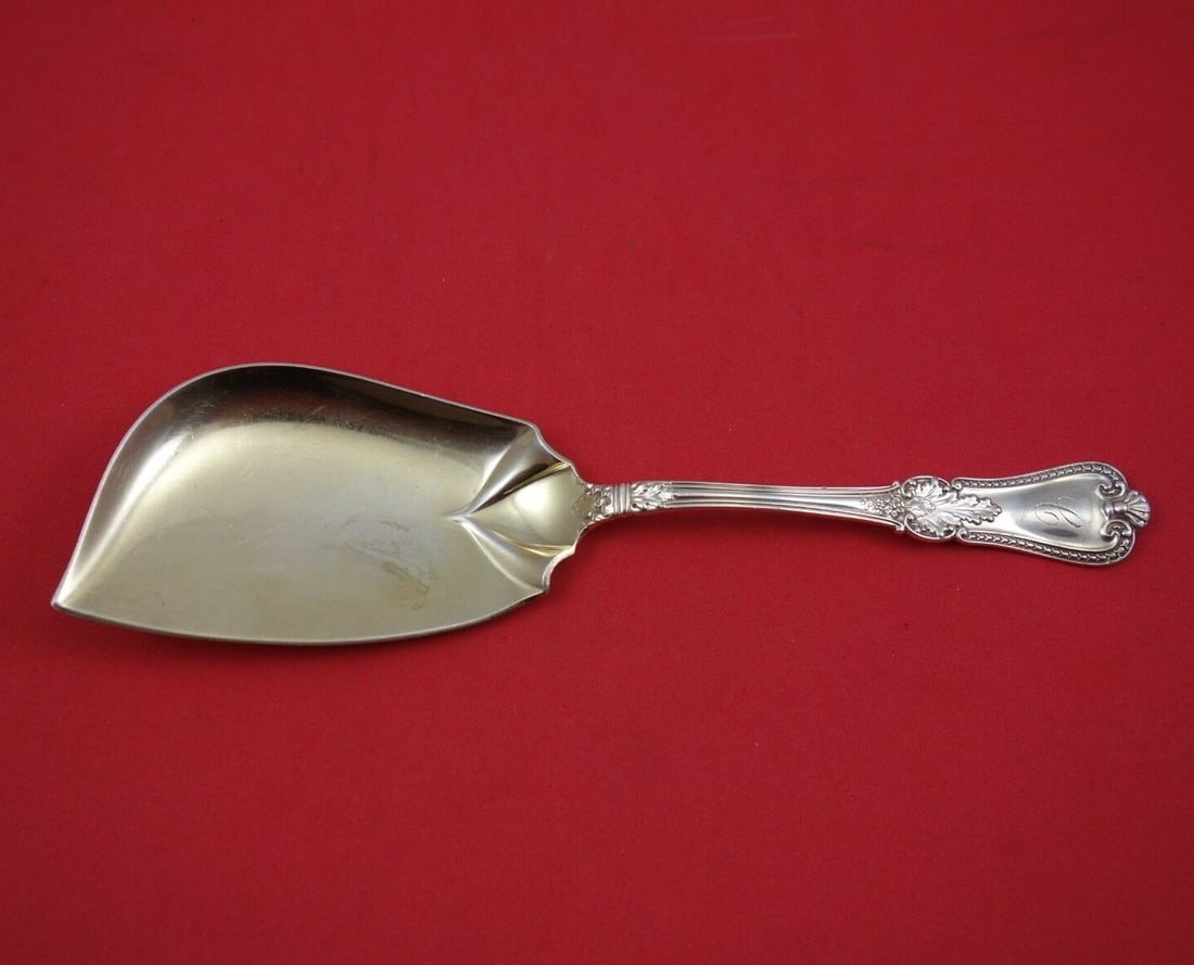 Gorham Kensington Sterling Silver Jelly Knife Goldwashed 7.625": Gorham Kensington Sterling Silver Jelly Knife Goldwashed 7.625" This exquisite jelly knife features the Kensington pattern by Gorham, crafted from sterling silver and enhanced with a goldwash finish.