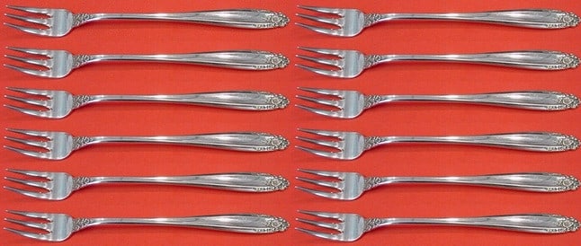 International Prelude Sterling Silver Cocktail Fork Set 12 Pieces: International Prelude Sterling Silver Cocktail Fork Set 12 Pieces This exquisite 12-piece cocktail fork set from the Prelude pattern by International Sterling is a timeless addition to any collection.