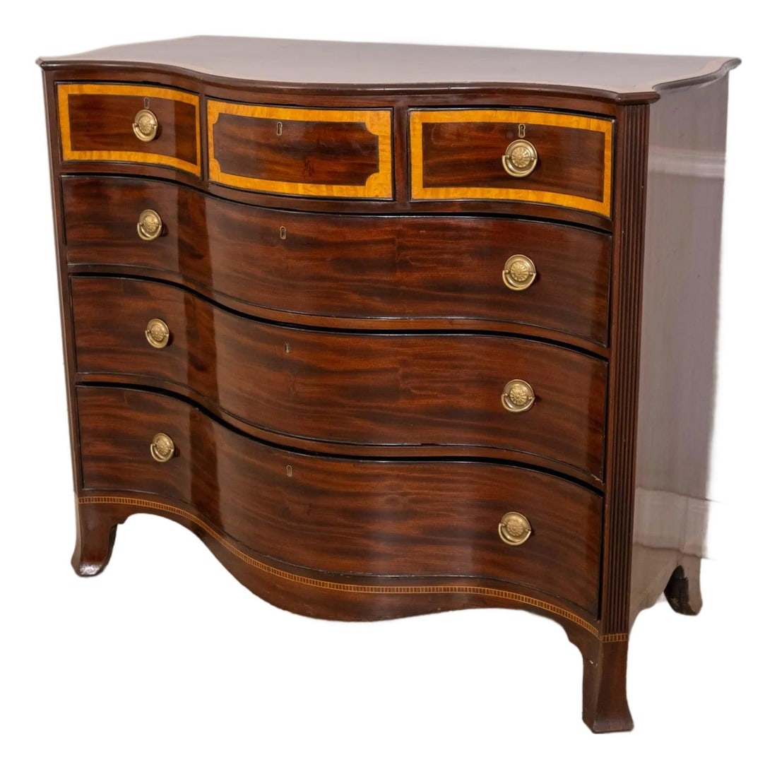 19th Century English Serpentine Mahogany Chest with Inlay: 19th Century English Serpentine Mahogany Chest with Inlay This exquisite antique chest, dating from the early 19th century (circa 1800-1840), showcases the elegant serpentine design typical of the era