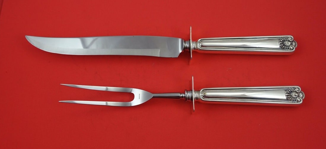 Frank Smith Fiddle Shell Sterling Silver 2-Piece Carving Set: Frank Smith Fiddle Shell Sterling Silver 2-Piece Carving Set This exquisite 2-piece roast carving set features a knife measuring 13 1/2" and a fork measuring 12". Crafted by Frank Smith, the set showc