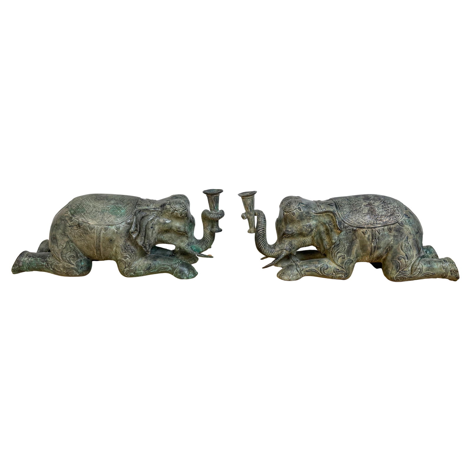 Set of 2 Sarried Ltd Asian Bronze Elephant Motif Candlesticks 1970s: Set of 2 Sarried Ltd Asian Bronze Elephant Motif Candlesticks 1970s Presenting a magnificent pair of Asian bronze candlesticks featuring a recumbent processional elephant motif. Attributed to the este