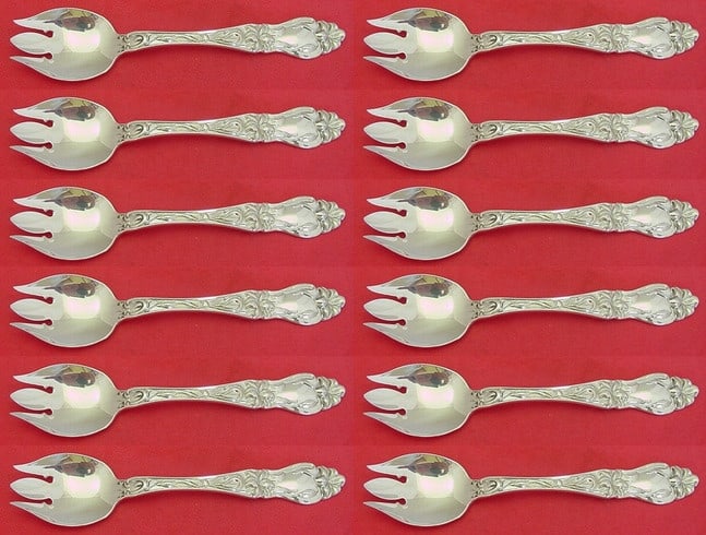 Frank Whiting Lily Sterling Silver Ice Cream Forks Set of 12 Custom 5 5/8": Frank Whiting Lily Sterling Silver Ice Cream Forks Set of 12 Custom 5 5/8" Elevate your dessert experience with this exquisite set of 12 ice cream forks from the renowned Lily pattern by Frank Whiting