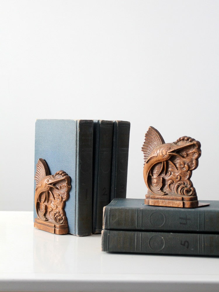 1940s Vintage Syroco Style Sailfish Bookends Decorative Home Accent: 1940s Vintage Syroco Style Sailfish Bookends Decorative Home Accent This charming pair of vintage bookends from the 1940s features sailfish leaping through stylized waves, expertly crafted to emulate