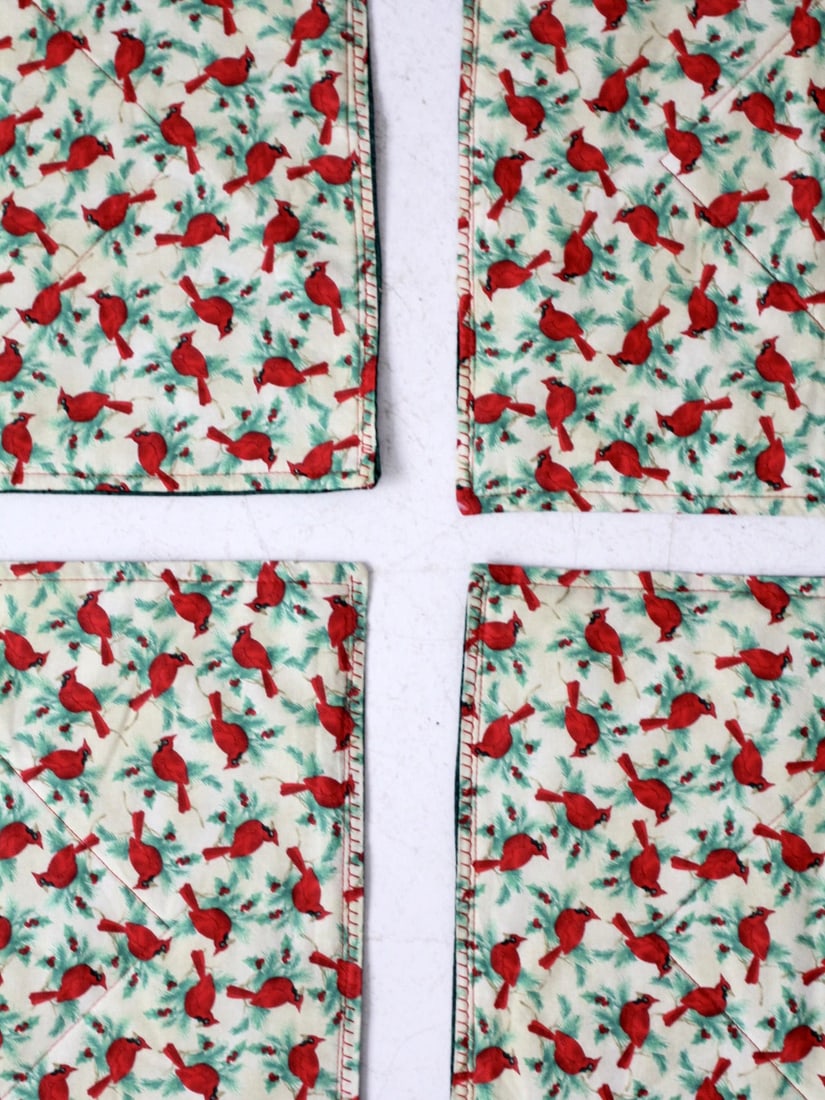 Handmade Holiday Placemats Set of 6 Red Cardinals: Handmade Holiday Placemats Set of 6 Red Cardinals Enhance your holiday dining experience with this charming set of six handmade quilted placemats. Each placemat features a delightful pattern of red ca