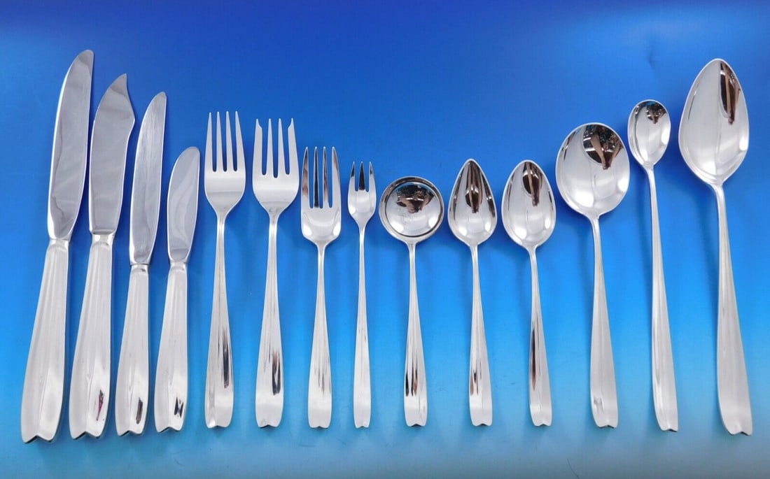 Tiffany & Co Sterling Silver Clinton Flatware Set 124 pcs Mid-Century: Tiffany & Co Sterling Silver Clinton Flatware Set 124 pcs Mid-Century Elevate your dining experience with this exquisite 124-piece Sterling Silver Flatware Set by Tiffany & Co., featuring the elegant