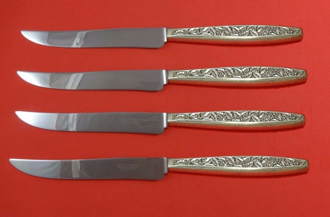 Valencia International Sterling Silver 4-Piece Texas Sized Steak Knife Set: Valencia International Sterling Silver 4-Piece Texas Sized Steak Knife Set Experience the perfect blend of elegance and functionality with the Valencia by International Sterling Silver Steak Knife Set