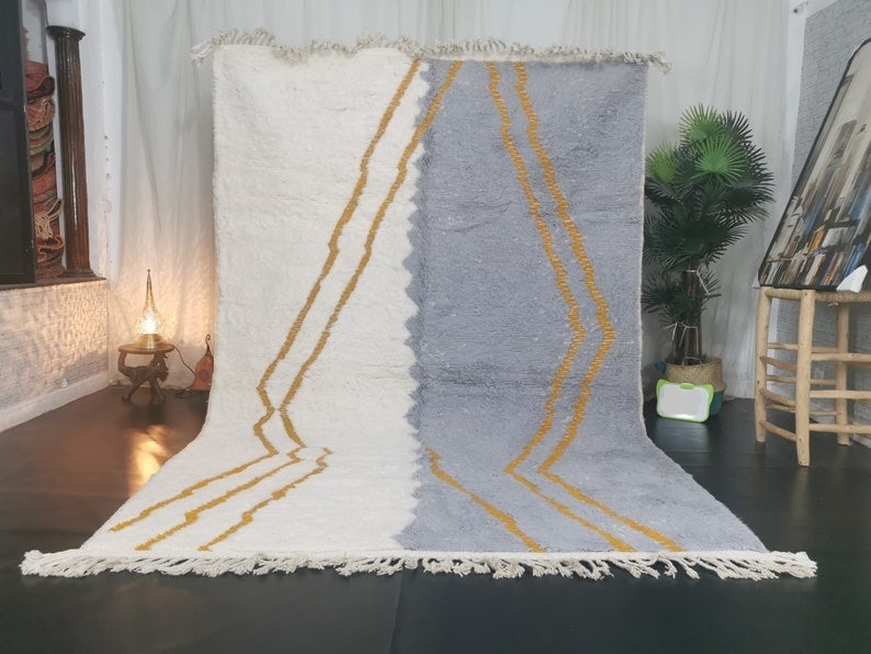 Handmade Moroccan Wool Area Rug 100% Sheep Wool 9.84 x 6.56 Feet: Handmade Moroccan Wool Area Rug 100% Sheep Wool 9.84 x 6.56 Feet Experience the exquisite craftsmanship of this stunning handmade Moroccan wool area rug. Handwoven in the Middle Atlas Mountains by ski