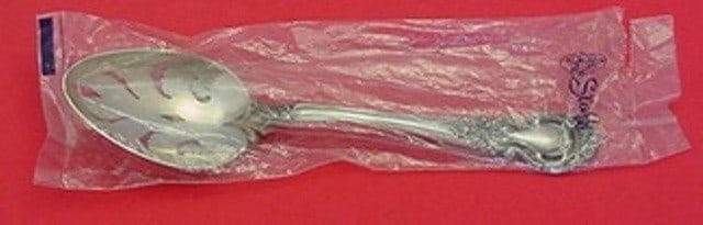 Kirk Royal Dynasty Sterling Silver Slotted Serving Spoon 8 3/4": Kirk Royal Dynasty Sterling Silver Slotted Serving Spoon 8 3/4" This exquisite serving spoon is a stunning piece from the Royal Dynasty pattern by Kirk. Crafted from high-quality sterling silver, this