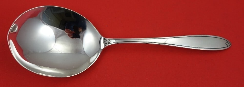 Hallmark Fiesta Sterling Silver Berry Spoon 9 1/4": Hallmark Fiesta Sterling Silver Berry Spoon 9 1/4" This exquisite Fiesta by Hallmark berry spoon is crafted from high-quality sterling silver, measuring 9 1/4" in length. The spoon features the iconic
