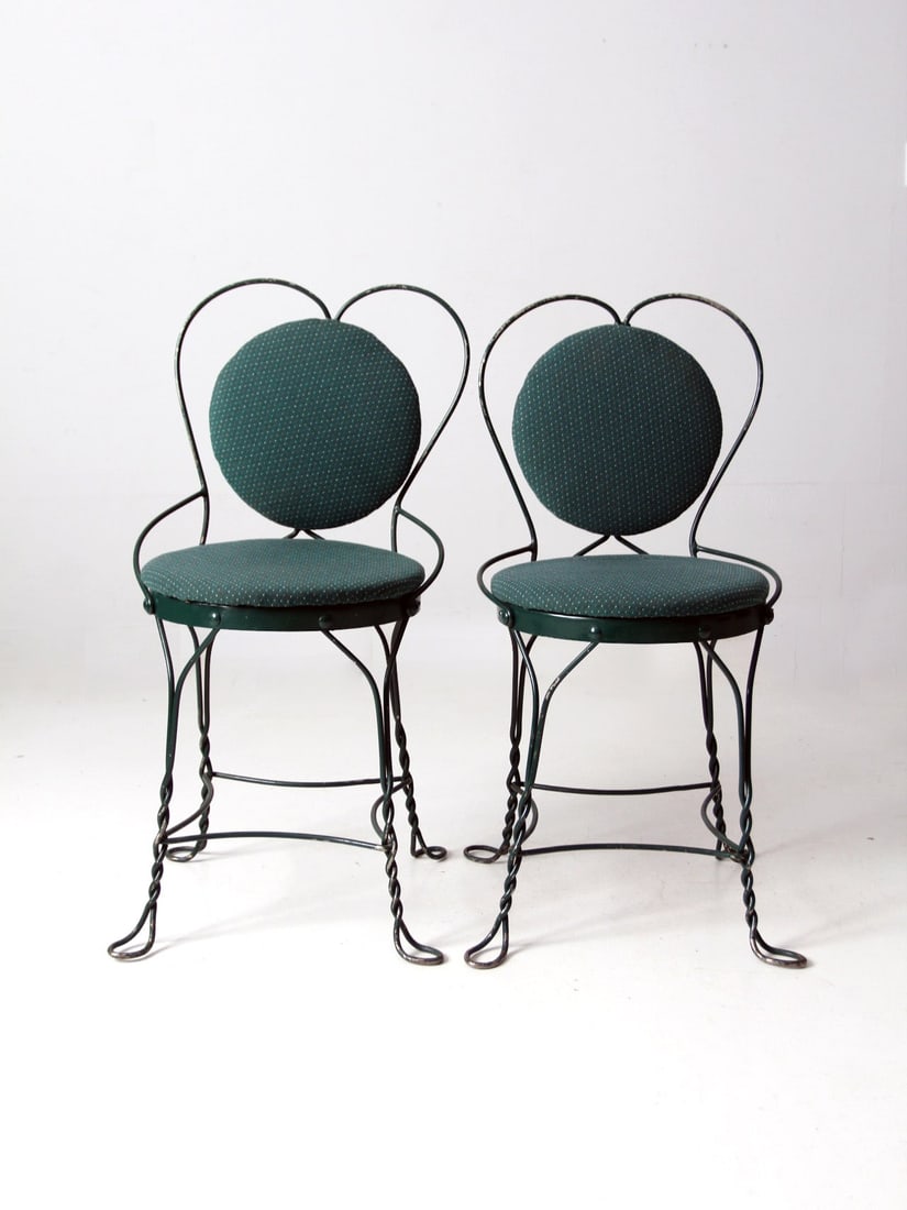 Charming Vintage Art Nouveau Ice Cream Parlor Chairs Pair: Charming Vintage Art Nouveau Ice Cream Parlor Chairs Pair This pair of vintage ice cream parlor chairs showcases a charming art nouveau design, featuring vibrant green metal frames with classic sweeth
