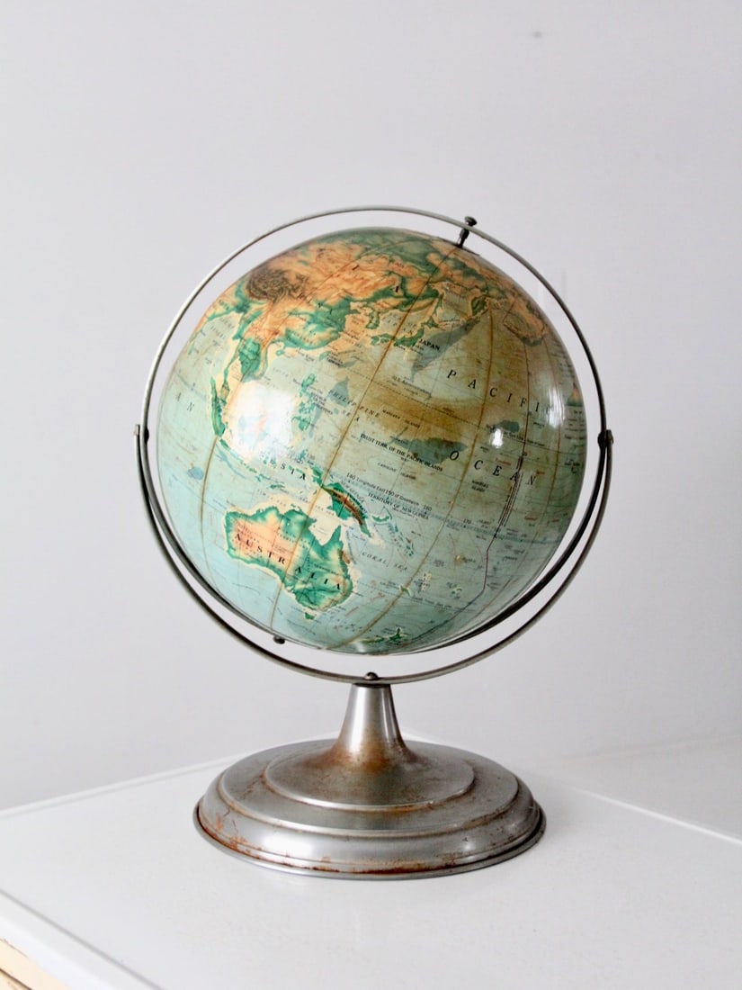 1960s Pictorial Relief Globe with 16 Inch Diameter and Raised Topography: 1960s Pictorial Relief Globe with 16 Inch Diameter and Raised Topography This early 1960s Nystrom pictorial relief globe features a 16 inch diameter with raised topography, set in a metal meridian and