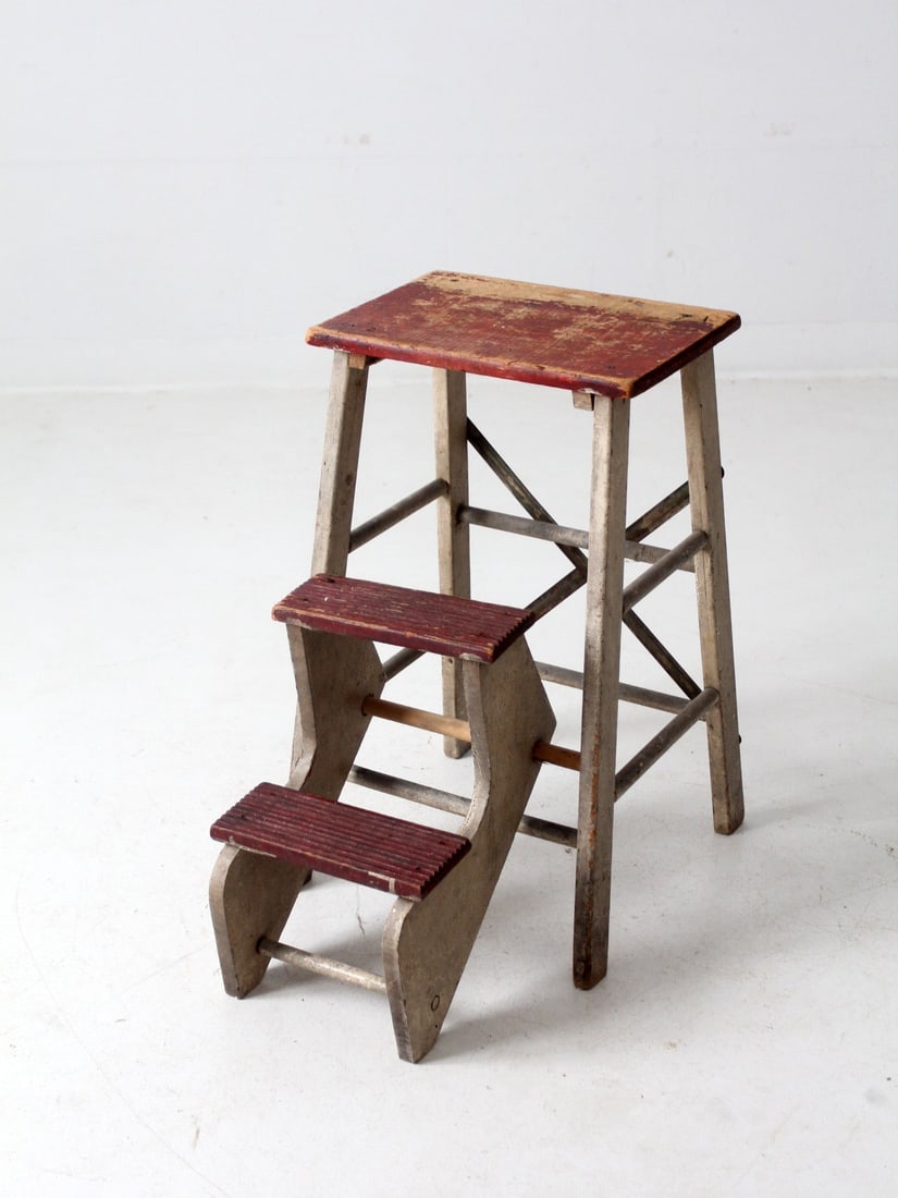 1930s Vintage Folding Step Stool Rustic Library Ladder: 1930s Vintage Folding Step Stool Rustic Library Ladder This vintage folding step stool, dating back to the 1930s, showcases a charming library ladder design with fold-out steps for convenient use and