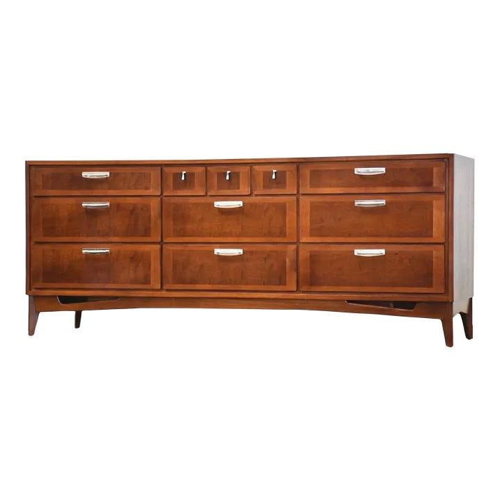 1970s Red Lion Walnut Dresser with Steel Hardware: 1970s Red Lion Walnut Dresser with Steel Hardware This elegant mid-century modern dresser, crafted from walnut by Red Lion Furniture, showcases a stylish design complemented by polished steel hardware