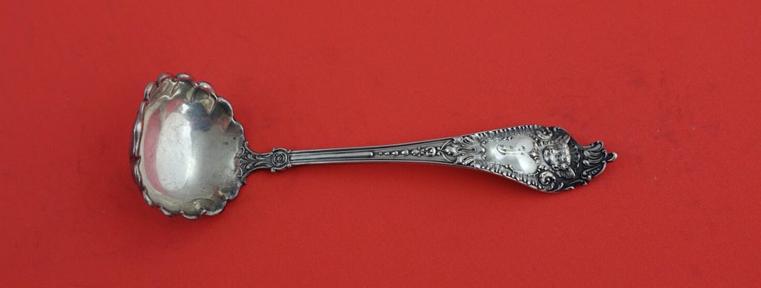 Watson-Newell Cherub Sterling Silver Fluted Mayonnaise Ladle 5.5": Watson-Newell Cherub Sterling Silver Fluted Mayonnaise Ladle 5.5" This exquisite mayonnaise ladle from the Cherub pattern by Watson-Newell features a beautifully crafted fluted bowl, measuring 5 1/2 i