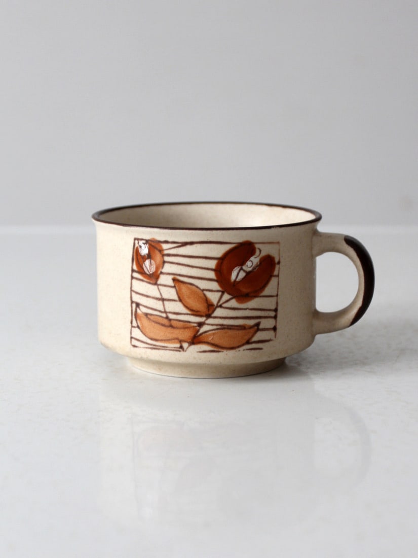 1970s Otagiri Japanese Stoneware Mug Floral Design: 1970s Otagiri Japanese Stoneware Mug Floral Design This vintage 1970s Otagiri style Japanese stoneware soup mug showcases a charming mod floral design. The vibrant colors and intricate pattern make it
