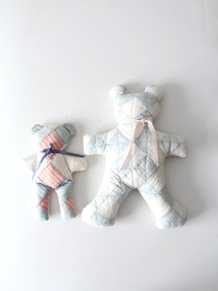 Charming Vintage Quilted Teddy Bears Pair Handmade Patchwork: Charming Vintage Quilted Teddy Bears Pair Handmade Patchwork This charming pair of vintage hand-made quilted teddy bears showcases delightful blue, white, and pink patchwork patterns, each adorned wit
