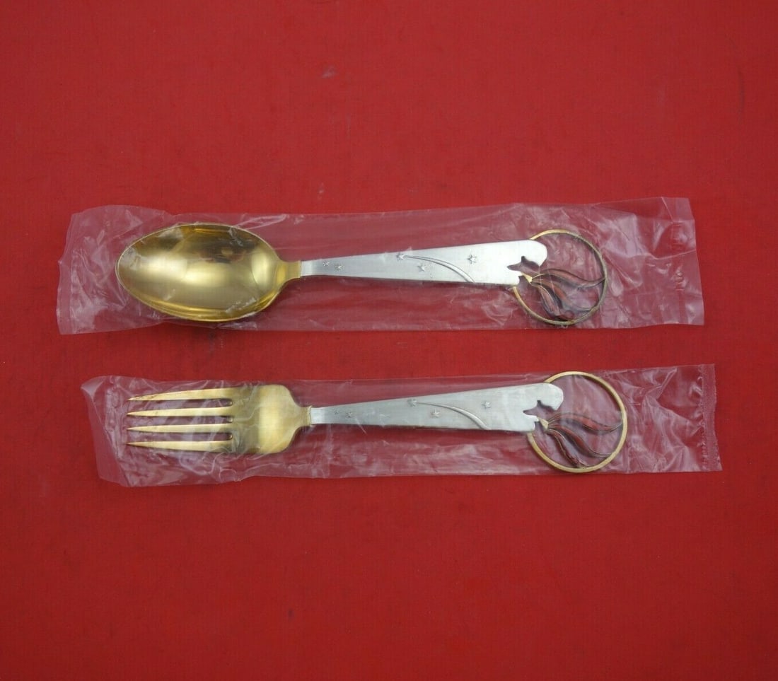 A. Michelsen Christmas 2pc Sterling Silver Fork Spoon Set Vermeil 1933 Little Match Girl: A. Michelsen Christmas 2pc Sterling Silver Fork Spoon Set Vermeil 1933 Little Match Girl This exquisite 2-piece fork and spoon set, made by A. Michelsen, features a charming Christmas pattern inspired