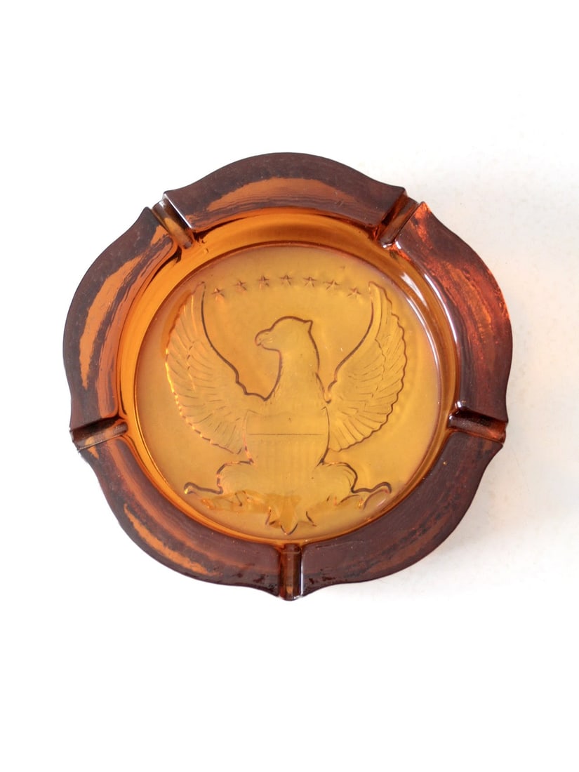 Vintage Amber Glass Ashtray with Federal Eagle Design 10 Inch: Vintage Amber Glass Ashtray with Federal Eagle Design 10 Inch This vintage amber glass ashtray showcases a striking Federal eagle design prominently featured at its center, complemented by five conven