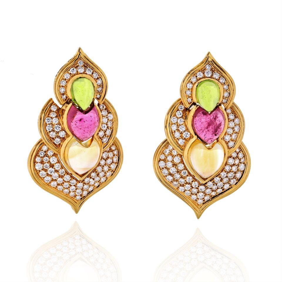 18K Yellow Gold Tourmaline Peridot Diamond Clip-On Earrings 5 Cts: 18K Yellow Gold Tourmaline Peridot Diamond Clip-On Earrings 5 Cts Elevate your jewelry collection with these stunning 18K Yellow Gold Clip-On Earrings, adorned with vibrant tourmaline, peridot, and sp