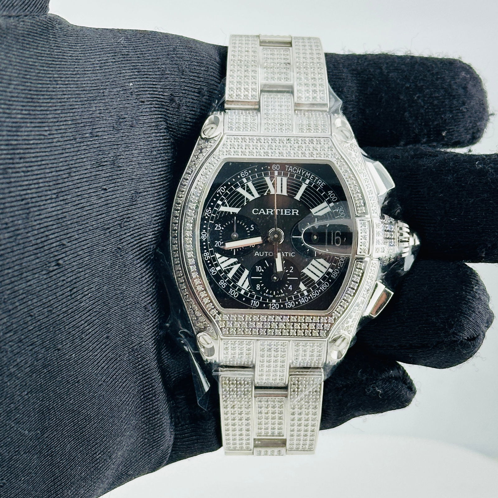 Cartier Roadster XL Ref 2618 Mens Watch with Black Dial and Diamond Accents: Cartier Roadster XL Ref 2618 Mens Watch with Black Dial and Diamond Accents This Cartier Roadster XL features a black dial, diamond bezel, and diamond bracelet. The watch is designed for men and is pa