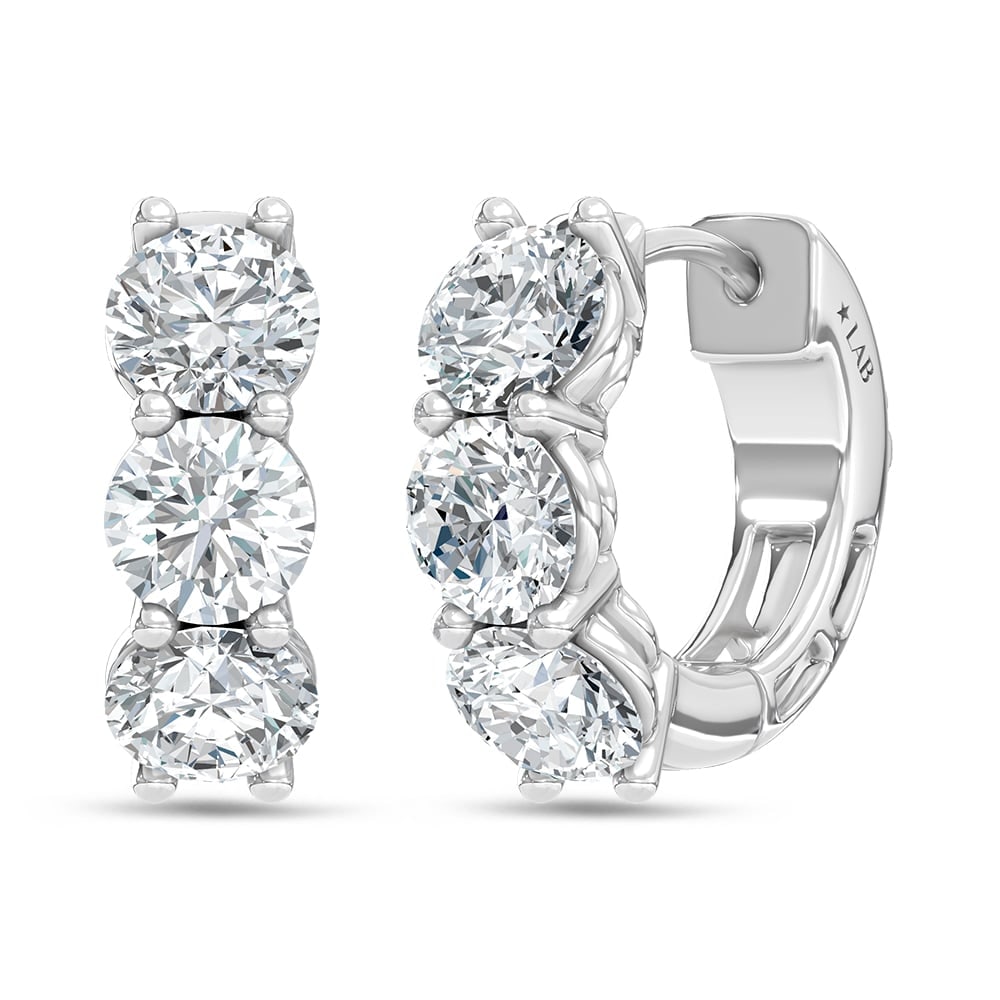 14K White Gold Lab Grown Diamond 2 Ct.Tw. 3 Stone Huggie Earrings: 14K White Gold Lab Grown Diamond 2 Ct.Tw. 3 Stone Huggie Earrings Elegant 14K white gold huggies adorned with 2 Ct.Tw. lab-grown diamonds in a 3-stone design. 14k White Gold Stone Color: D-f Stone Cla