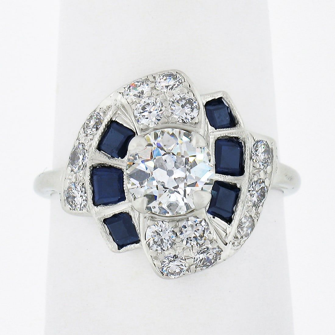 Vintage GIA Certified 1.76ctw Platinum Diamond Sapphire Cocktail Ring: Vintage GIA Certified 1.76ctw Platinum Diamond Sapphire Cocktail Ring This exquisite vintage cocktail ring features a stunning GIA certified old European cut diamond, weighing approximately 0.76 carat