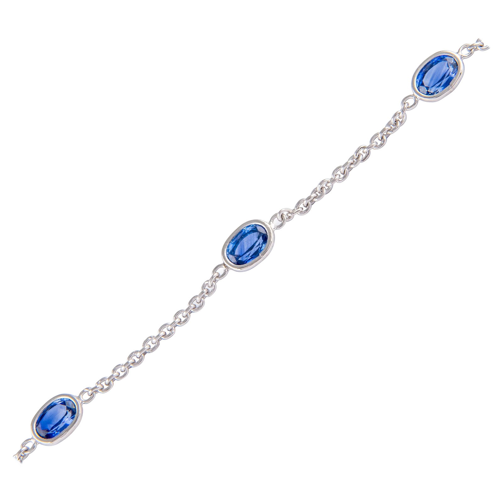 4.76ct Oval Sapphire Bracelet 18k White Gold Modern Design: 4.76ct Oval Sapphire Bracelet 18k White Gold Modern Design This exquisite bracelet features five stunning oval-cut sapphires totaling 4.76 carats, elegantly set in handcrafted bezels of 18k white gold