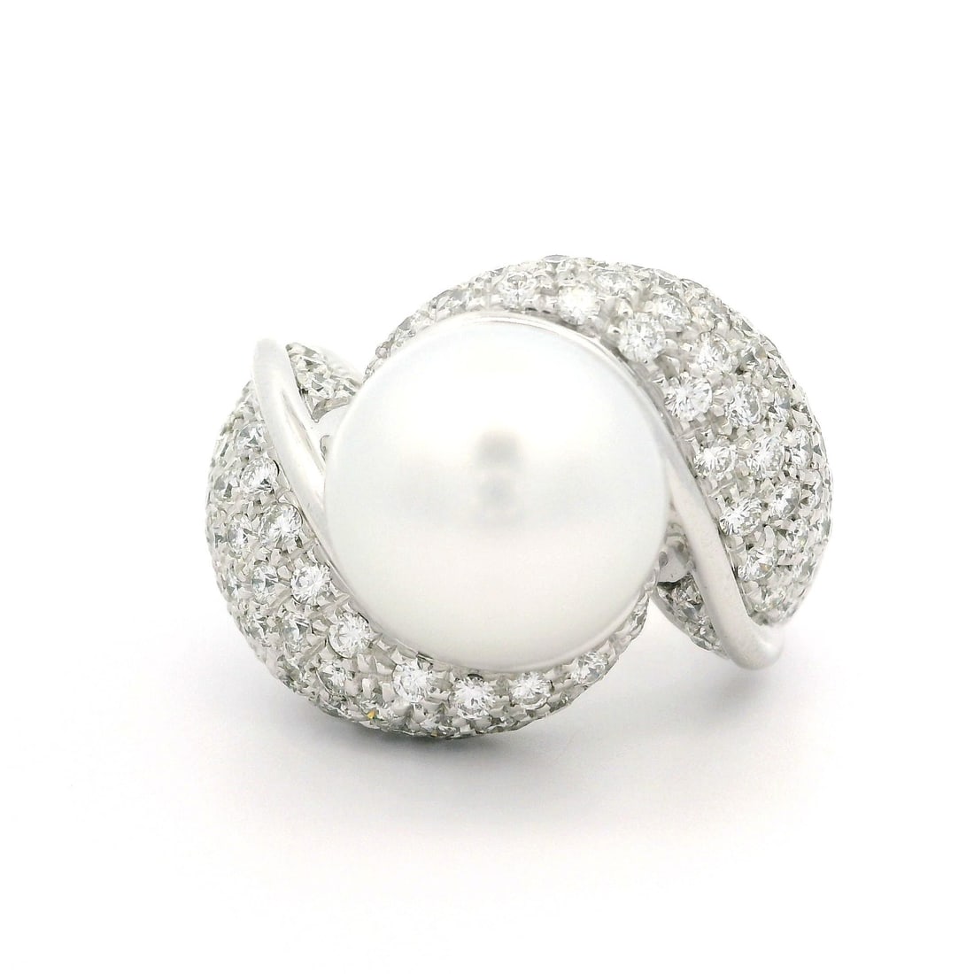 Elegant Solid White Gold Pearl Diamond Bypass Ring 2.20ctw: Elegant Solid White Gold Pearl Diamond Bypass Ring 2.20ctw This stunning cocktail ring features a large, genuine cultured pearl at its center, showcasing a round shape and a bright white hue with a li