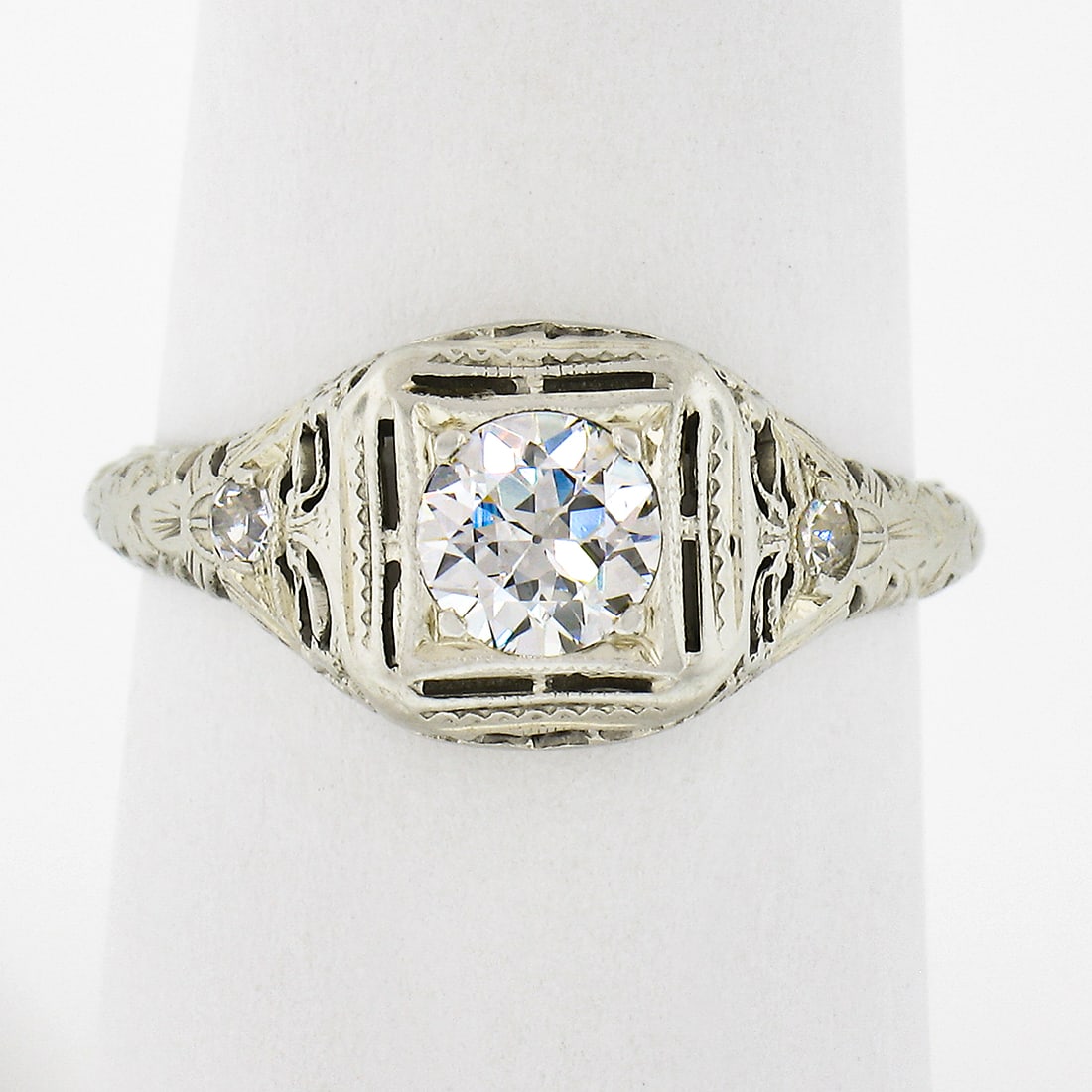 Antique Art Deco 18k White Gold Diamond Solitaire Engagement Ring: Antique Art Deco 18k White Gold Diamond Solitaire Engagement Ring This exquisite Antique Art Deco engagement ring is crafted from solid 18k white gold and features a stunning diamond solitaire with ac