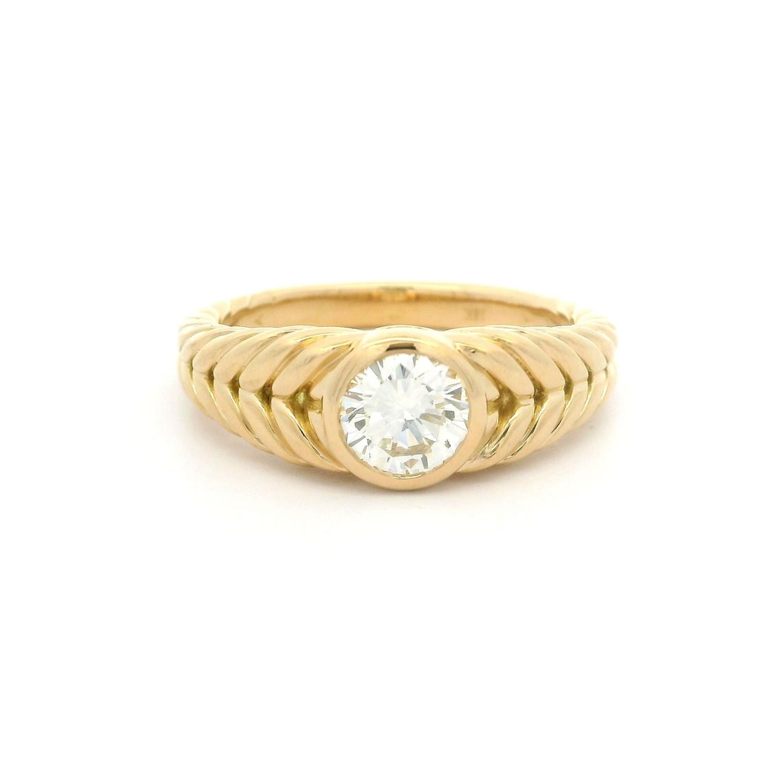 18k Yellow Gold GIA Certified 0.75ct Diamond Cable Braided Ring: 18k Yellow Gold GIA Certified 0.75ct Diamond Cable Braided Ring This exquisite 18k Yellow Gold ring features a stunning .75ct round bezel set diamond, showcasing a brilliant cut that captures light be