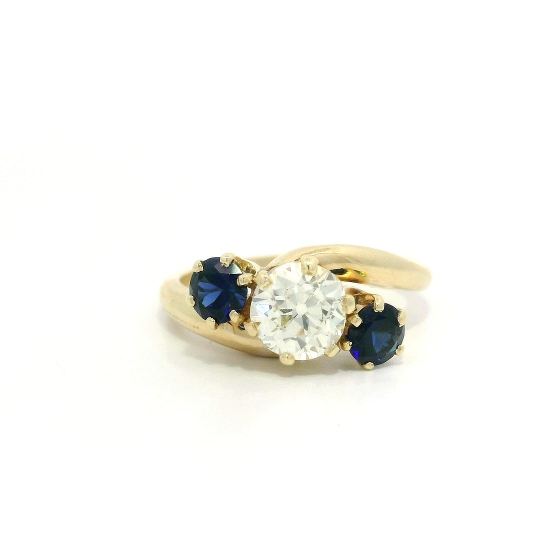 Vintage 14k Yellow Gold 1.45ctw Diamond Sapphire Accent Ring: Vintage 14k Yellow Gold 1.45ctw Diamond Sapphire Accent Ring This exquisite vintage ring features a stunning combination of a 1.45ctw Old European Cut diamond and royal blue sapphire accents. The main