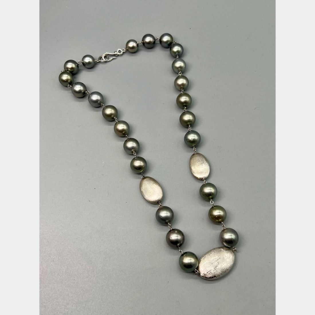 Black South Sea Pearl Strand with 14K White Gold Clasp 18.5 Inch: Black South Sea Pearl Strand with 14K White Gold Clasp 18.5 Inch This elegant necklace features black South Sea pearls set in 14K white gold. The pearls each measure 12.0mm in diameter, and the neckla