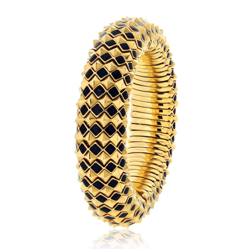 David Webb 18K Gold Spike Enamel Pyramid Slip On Bracelet: David Webb 18K Gold Spike Enamel Pyramid Slip On Bracelet This exquisite David Webb 18K Yellow Gold Spike Black Enamel Pyramid Slip On Bracelet showcases the brand's iconic design. The bracelet featur