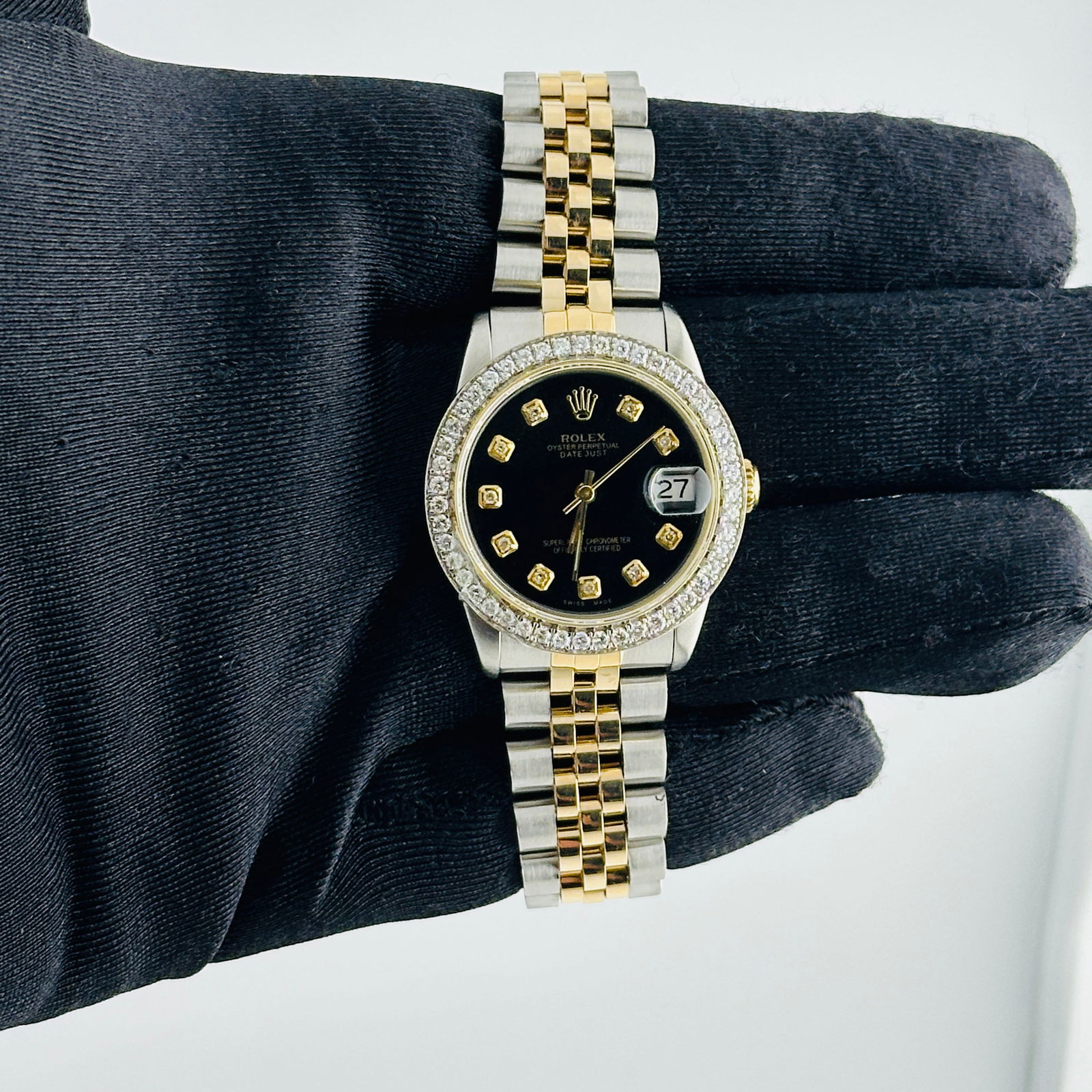 Ladies Datejust Reference 68273 Aftermarket Black Diamond Dial D-Link Jubilee: Ladies Datejust Reference 68273 Aftermarket Black Diamond Dial D-Link Jubilee This Rolex Datejust watch for ladies features an after-market black diamond dial and a D-Link Jubilee bracelet. The bezel
