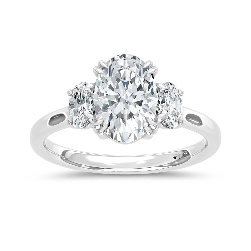 14K White Gold Lab Grown Diamond 2 Ct.Tw. Oval Shape Three Stone Engagement Ring: 14K White Gold Lab Grown Diamond 2 Ct.Tw. Oval Shape Three Stone Engagement Ring This stunning three-stone ring features a sparkling 1 1/2 CT Oval Center diamond with two shimmering side diamonds, sym