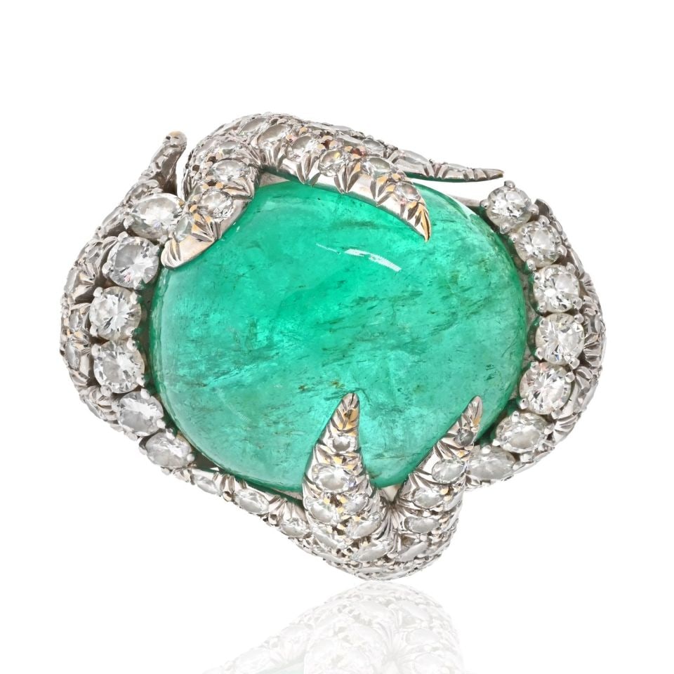 David Webb Platinum Emerald Diamond Ring 26cts 6cts Signed: David Webb Platinum Emerald Diamond Ring 26cts 6cts Signed This stunning David Webb ring features a captivating oval cabochon cut green emerald weighing approximately 26 carats, elegantly complemented