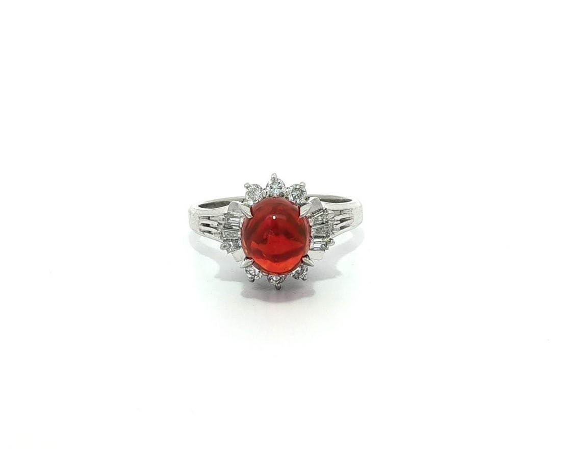 Stunning Platinum 1.43ctw Oval Orange Fire Opal Diamond Cocktail Ring: Stunning Platinum 1.43ctw Oval Orange Fire Opal Diamond Cocktail Ring This exquisite cocktail ring showcases a stunning natural fire opal, expertly crafted in solid platinum. The centerpiece is a vivi