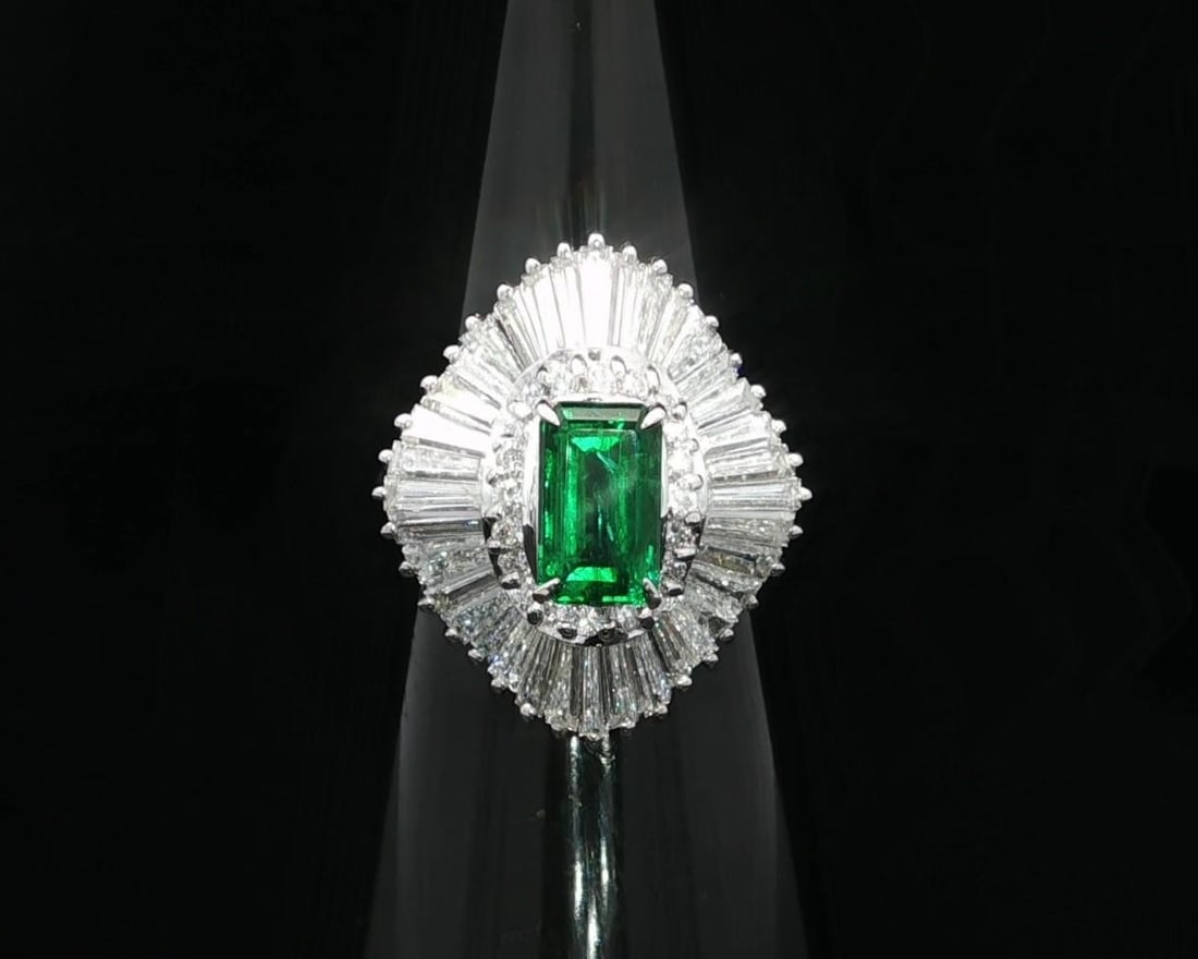 GIA Certified 3.87ctw Platinum Emerald Diamond Ballerina Ring: GIA Certified 3.87ctw Platinum Emerald Diamond Ballerina Ring This stunning cocktail ring features a natural genuine emerald with a long emerald octagonal step cut, prong set to showcase its vivid gre