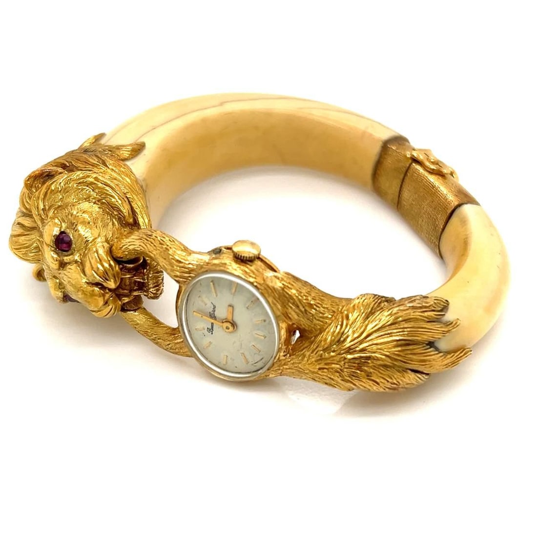 1960s Buche Girod 18K Yellow Gold Watch Bangle with Rubies: 1960s Buche Girod 18K Yellow Gold Watch Bangle with Rubies This exquisite 1960's Buche Girod French watch/bangle is crafted from 18K yellow gold, weighing 89.9 grams. It is beautifully set with two ru