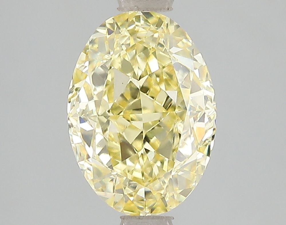 Loose Diamond - OVAL 3.03ct Fancy Vivid Yellow VS1: Loose Diamond - OVAL 3.03ct Fancy Vivid Yellow VS1 Source: This is a real non-mined Diamond that has been grown in a lab Shape: OVAL Carats: 3.03 Color: Fancy Vivid Yellow Certification: IGI Video: