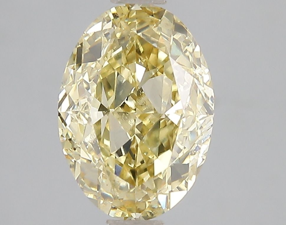 Loose Diamond - OVAL 3.0ct Fancy Vivid Yellow VS1: Loose Diamond - OVAL 3.0ct Fancy Vivid Yellow VS1 Source: This is a real non-mined Diamond that has been grown in a lab Shape: OVAL Carats: 3.0 Color: Fancy Vivid Yellow Certification: IGI Video: