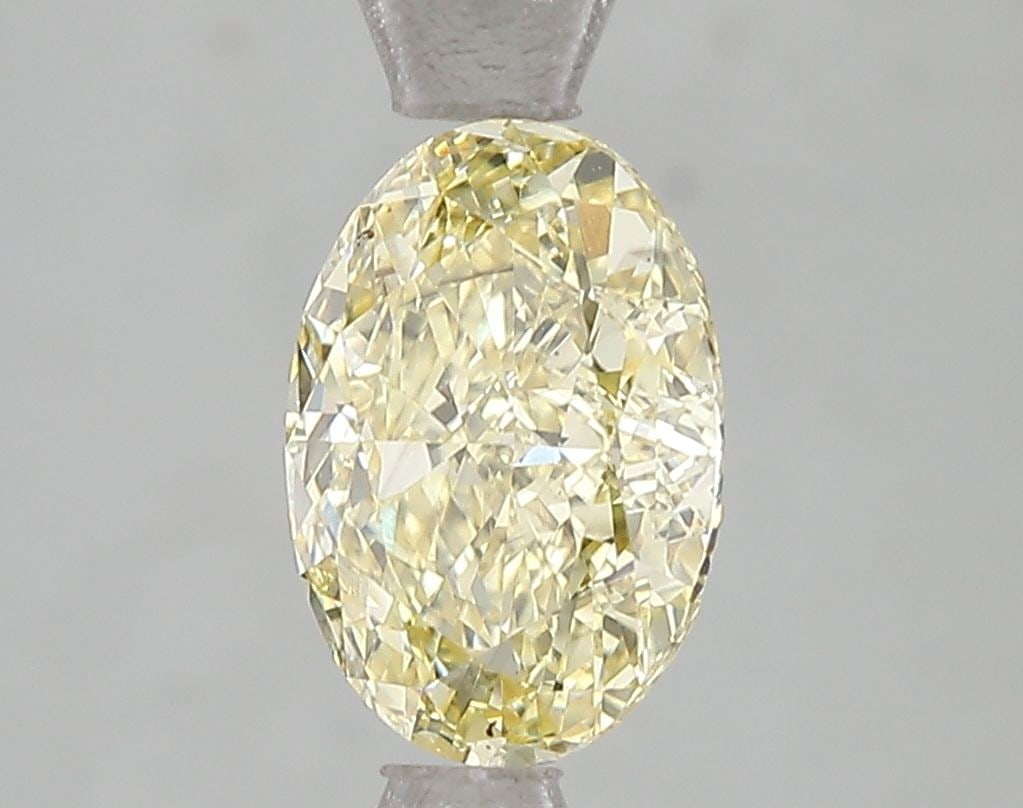 Loose Diamond - OVAL 2.0ct Fancy Vivid Yellow SI1: Loose Diamond - OVAL 2.0ct Fancy Vivid Yellow SI1 Source: This is a real non-mined Diamond that has been grown in a lab Shape: OVAL Carats: 2.0 Color: Fancy Vivid Yellow Certification: IGI Video: